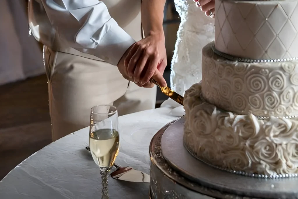 A person cutting a cake with a knife.