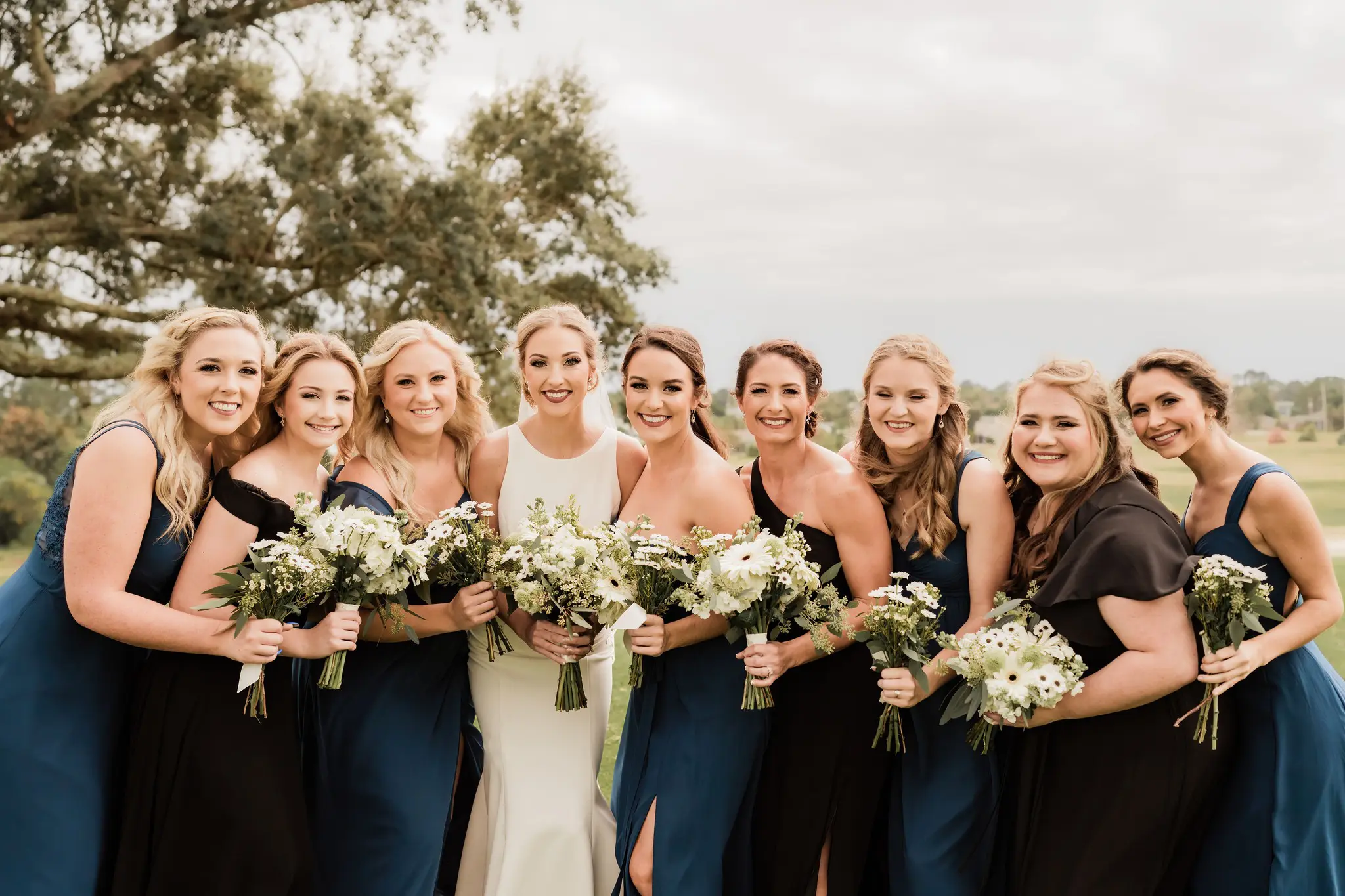 A group of women standing next to each other.